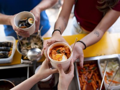 close-up-hands-holding-cup-with-food
