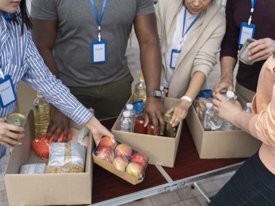 group-different-people-volunteering-foodbank-poor-people