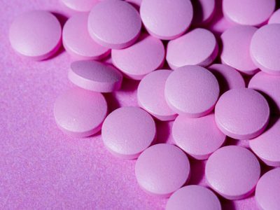 high-angle-pills-purple-background